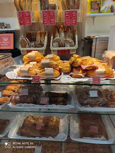 Fotografia tomada fuera de Panadería El Trigal - Panadería en León, León